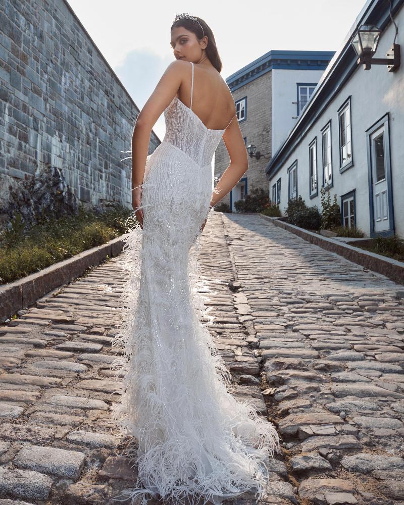 124125 fitted sparkly wedding dress with feathers and spaghetti straps2
